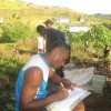 The village Chief taking notes during compost training module Fiji Highlands
